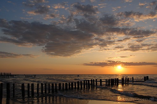 sunset; clouds; sea; breakwater