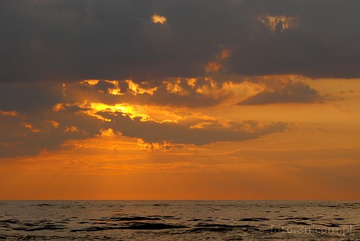 sunset; clouds; sea